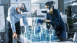 © Gorodenkoff - Male and Female Architects Wearing  Augmented Reality Headsets Work with 3D City Model. High Tech Office Professional People Use Virtual Reality Modeling Software Application.