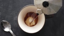 Super Slow Motion Top View Of Coffee Pour Into Cup From Geyser Coffee Maker