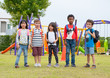 © weedezign - group of diversity school children playing at playground in kindergarten preschool.back to school.