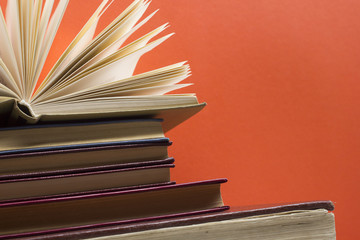 Open book, hardback books on wooden table. Back to school. Copy space