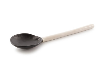 Wall Mural - Black and white Ceramic Spoon isolated on a white background