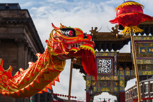 The Traditional Dragon Dance Captured In Front Of The Paifang In Liverpool's Chinatown District In February 2018 During The Chinese Spring Festival.