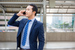 © Worapoj - Businessman talking on mobile phone for work.