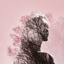 Portrait Of A Girl With Double Exposure Against A Tree Crown. Delicate Mysterious Portrait Of A Woman With A Pink Sky