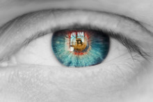 Bitcoin. Eye of person with bitcoin coin logo in pupil