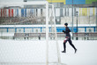 © Sergey Mironov - Photo of running athlete in black clothes near gate in stadium