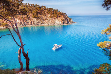 picturesque scenery of coastline of turkey on mediterranean sea. solitary luxury white yacht in the 