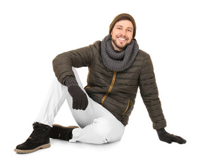 Sticker - Young man in warm clothing on white background. Ready for winter vacation