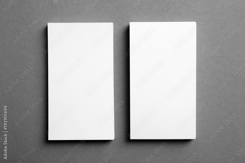 Blank business cards on grey background