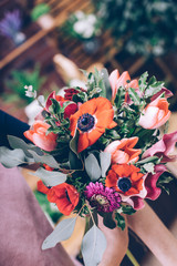 Poster - Florist arrangement a flowers bouquet at his workplace