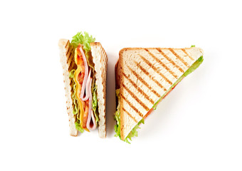 Sandwich with ham, cheese, tomatoes, lettuce, and toasted bread. Top view isolated on white background.