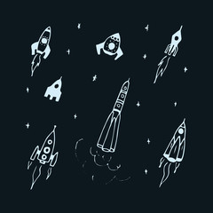 Wall Mural - Vector set of hand drawn doodle rocket icon and rocket silhouette. Icon design rocket, spaceships, rocket ship