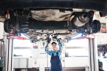 Portrait of a senior female mechanic in a garage.