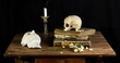 Classical Baroque Still-life in Vantias style with Skull and Death-Mask on a black Background