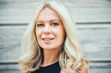 Wall Mural - outdoor portrait of beautiful blond woman, close up, beauty concept