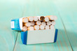 Pack of cigarettes on a blue wooden background