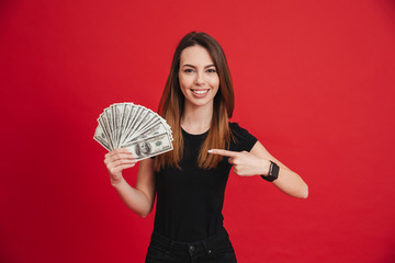 Poster - Portrait of a happy girl pointing finger