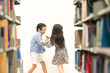 © Nattanon - Happy kids lifestyle in the Library. Young people explore lifestlye in the Library. Development of Human Resources in Education Concept. Setup studio shooting.