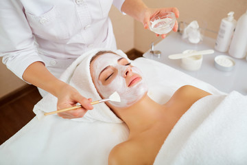 Wall Mural - woman in mask on face in spa beauty salon.