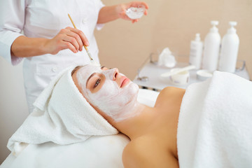 Wall Mural - woman in mask on face in spa beauty salon.