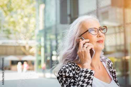 Attractive Older Woman Wearing Glasses With Long Grey Hair