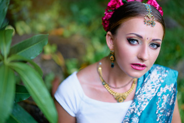 Wall Mural - Portrait of beautiful young caucasian woman in traditional indian clothing sari with bridal makeup and jewelry.