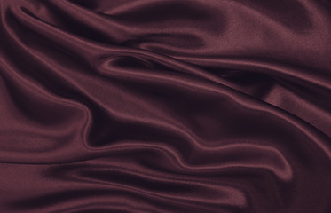 Smooth elegant pink silk or satin luxury cloth texture as abstract background. Luxurious valentines day background design