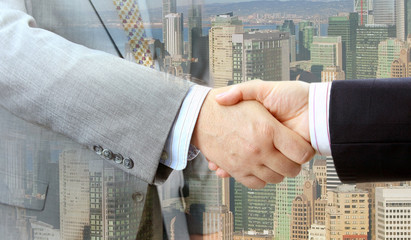 Aufkleber - Closeup of business people handshake on big city background 
