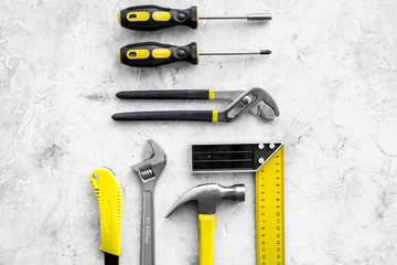 Various repair tools. Must-have for men. Equipment for building. Repair tool kit. Grey background top view pattern copy space