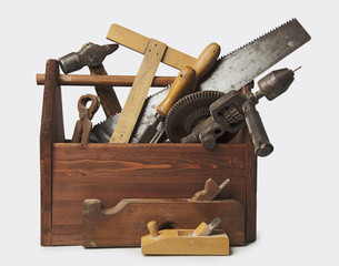 Wall Mural - Old Carpenter Wooden toolbox with tools isolated on white