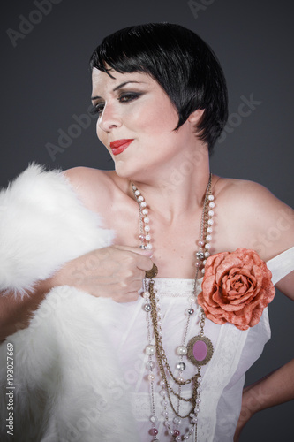 Brunette Girl With Short Hair French Mane In The Style Of The 20s