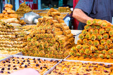 Variety Of Sweets On The Arab Street Market Stall. Eastern Sweets In A Wide Range, Baklava, Turkish Delight With Almond, Cashew And Pistachio Nuts.