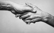 A firm handshake between two partners. Black and white image on white  background.