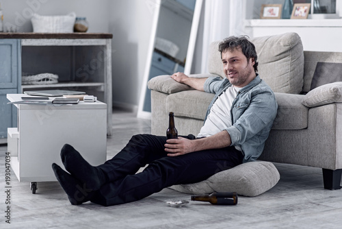 Untidy Place Unshaved Lazy Person Sitting On The Floor Next To