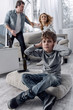 © Viacheslav Yakobchuk - Stop it. Furious emotional married people having an awful loud quarrel while their little scared worried son sitting not far from them and closing his ears