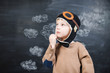 © Sonya - the boy in the pilot's cap plays a paper plane