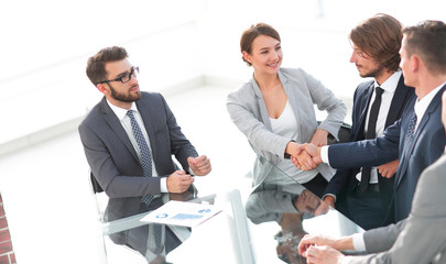 Wall Mural - handshake business women with business partner