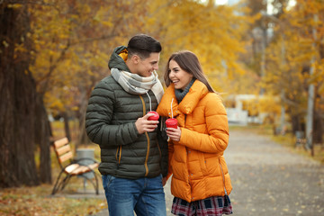 Canvas Print - Beautiful couple in warm clothes in park