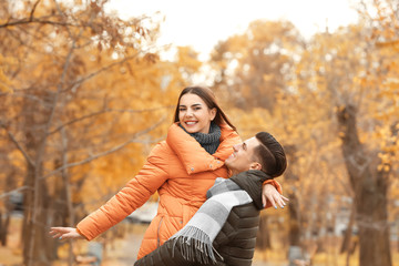 Canvas Print - Beautiful couple in warm clothes in park