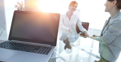 Poster - laptop and a smartphone on the desktop of a businessman