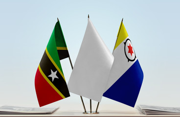 Flags of Saint Kitts and Nevis and Bonaire with a white flag in the middle