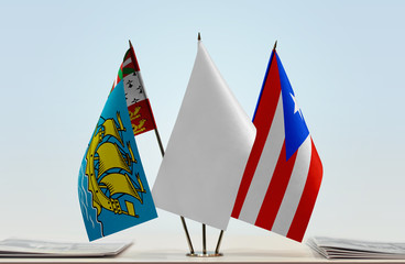 Flags of Saint Pierre and Miquelon and Puerto Rico with a white flag in the middle