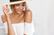 © WHstudio Leushin N - Close up shot of attractive female with healthy pure skin, wears fashionable summer clothing, looks with positive expression down, isolated over white background, copy space for your promotional text