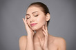 © Africa Studio - Portrait of beautiful young woman with clear skin on grey background