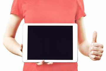 Canvas Print - Technology advertising concept image - girl in red t-shirt holding digital tablet with blank screen and showing thumbs up gesture.