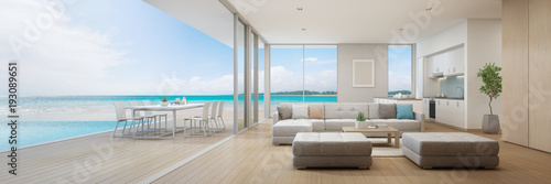 Photographie Sea view kitchen, dining and living room of luxury beach house with terrace near swimming pool in modern design
