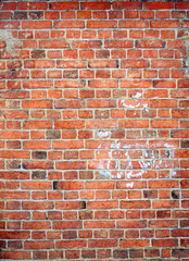 Texture of an old brickwork of red color