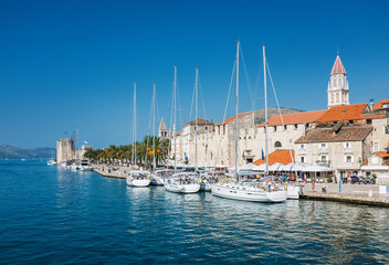 Wall Mural - sailing boats on embankment in old town of Trogir, Croatia