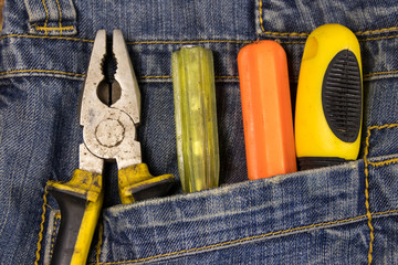 Wall Mural - Pliers and screwdrivers in the jeans pocket