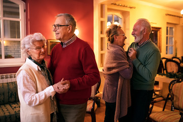 Wall Mural - Two senior couple dancing romatic at nursing home